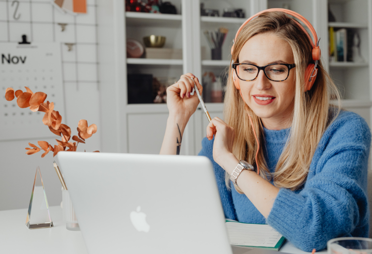 laptop and printed and written plan with a pencil.